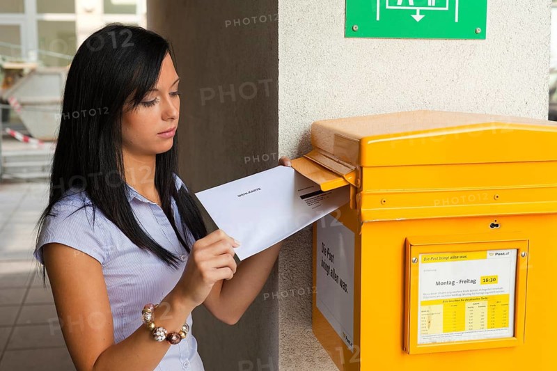 Young woman with a postal vote Austria