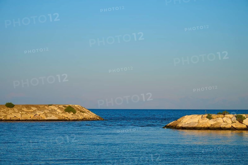 Clear sky and calm sea between two rocky coastlines, marina, Evrenseki, Manavgat, Antalya, Turkish Riviera, Mediterranean Sea, Turkey