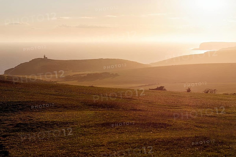 View from above of the coast and Belle Tout lighthouse, sunset, Eastbourne, South Downs, East Sussex, England, United Kingdom