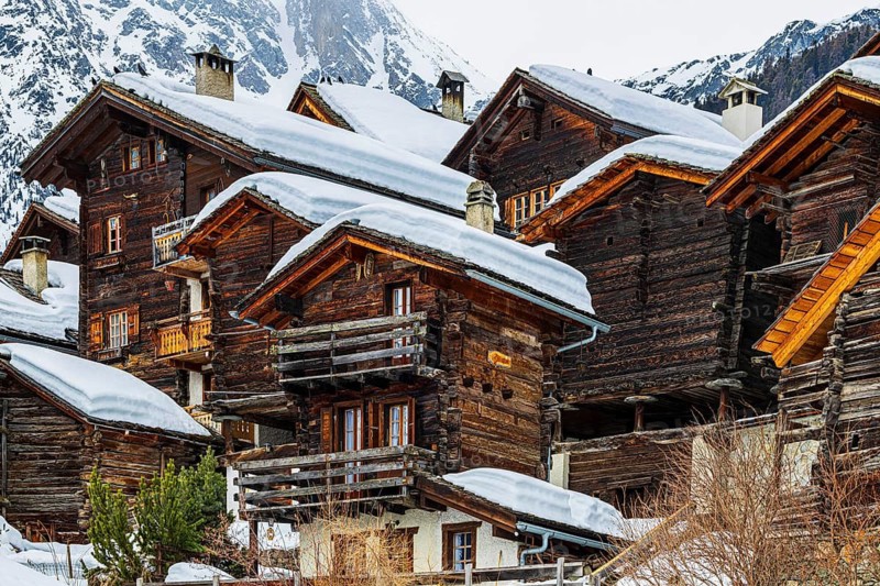 Old snow-covered wooden houses in the historic village centre, Grimentz, Val d'Anniviers, Valais Alps, Canton Valais, Switzerland