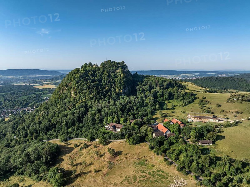 Aerial view of the Hohentwiel volcanic cone with Germany's largest fortress ruin, in the morning sun, a tourist attraction in the Lake Constance region, Hegau, Konstanz district, Baden-Württemberg, Germany