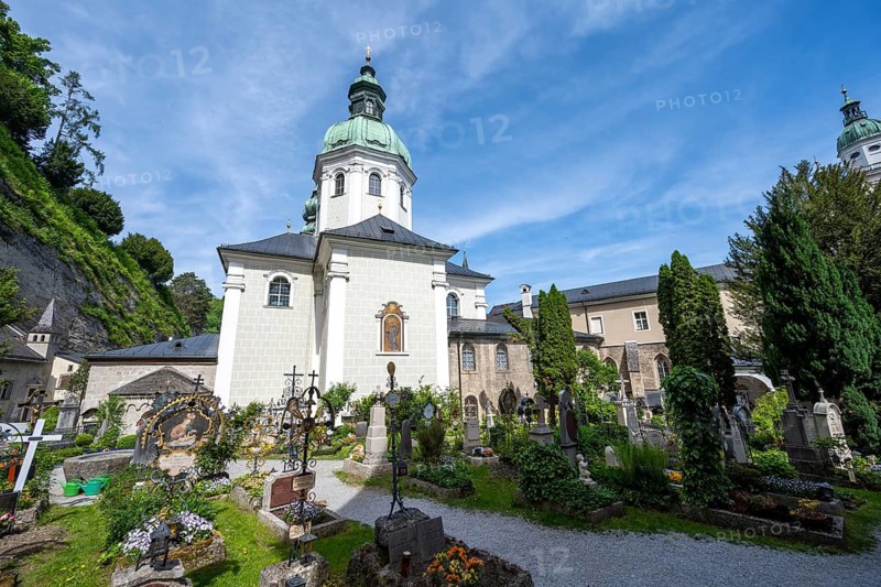 Graves at St. Peter Cemetery with St. Peter Collegiate Church, Old Town, Salzburg, Austria