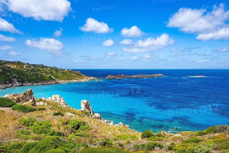 Coastline with emerald green and blue water on a sunny day at Santa Teresa di Gallura, Sardinia, Italy