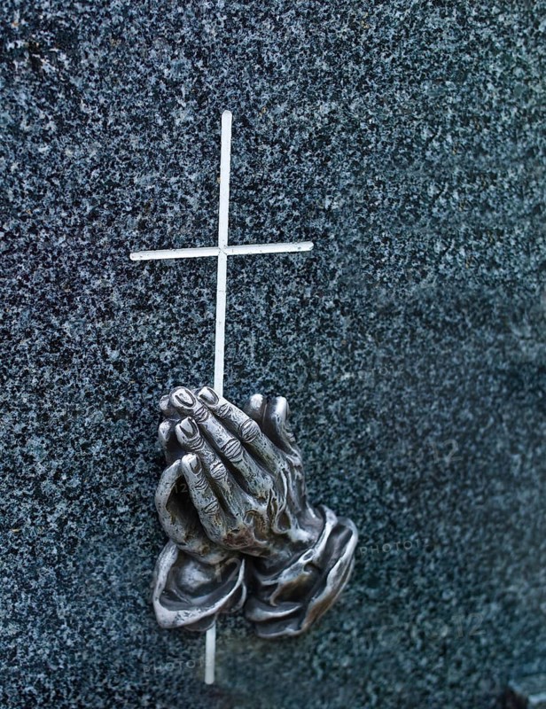 A tombstone in a cemetery. Praying hands by Albrecht Dürer, Ruehstätte, Bremen, Lower Saxony, Federal Republic of Germany