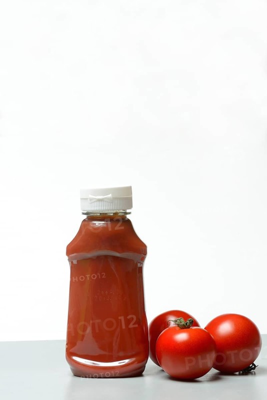 Ketchup, ketchup bottle and tomatoes