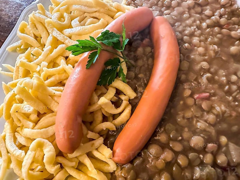 Swabian home cooking: lentils, spaetzle, string sausages. Traditional Swabian dish. Stuttgart, Baden-Württemberg, Germany