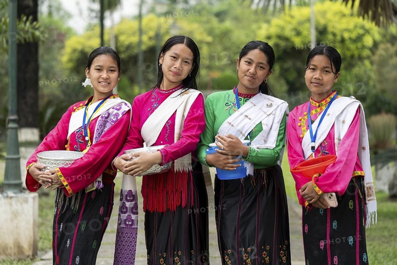 NAMSAI, INDIA.- APRIL 16: Young girls arrives to celebrate the vibrant Sangken Festival at Golden Pagoda in Namsai, India on 16 April 2025. Sangken Festival is a beautiful and culturally rich water festival celebrated primarily by the Theravada Buddhist communities, it marks the Buddhist New Year, typically falling in mid-April