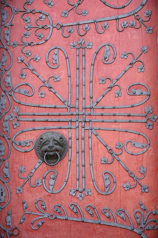 Red church door with fittings and decorations, crafts with ironwork, door handle with door knock ring, door knocker, Elizabeth Church, Marburg, Hesse, Germany
