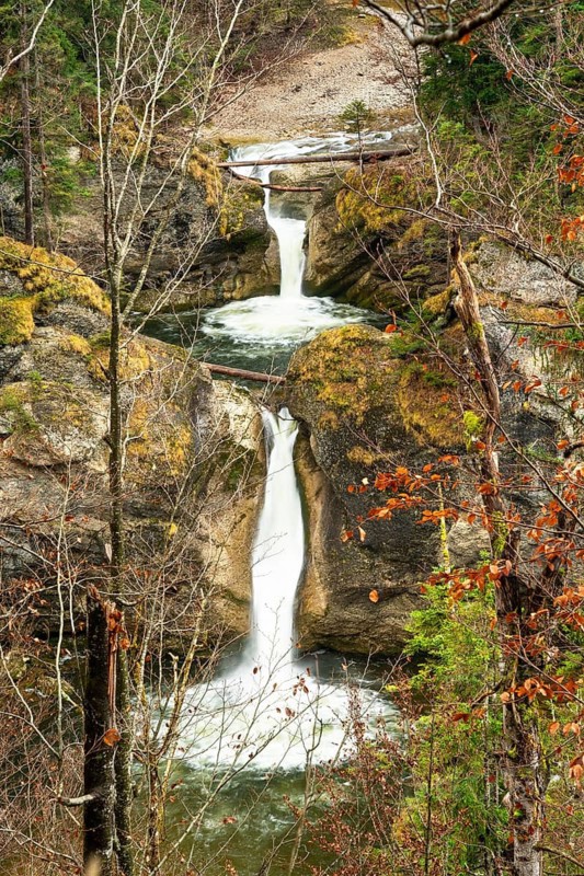 The Buchenegg waterfalls, surrounded by rocks. Autumn. Oberstaufen, Upper Allgäu, Bavaria, Germany