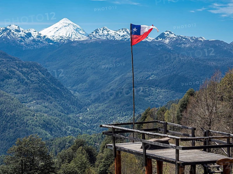 Viewpoint at trail to heart-shaped lake Laguna Corazon, chilenean flag, near Liquine, Chile
