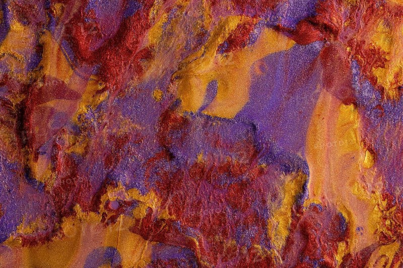 An artistic background showcasing a vibrant blend of red, purple, and gold metallic paints, creating a richly textured and visually stunning surface