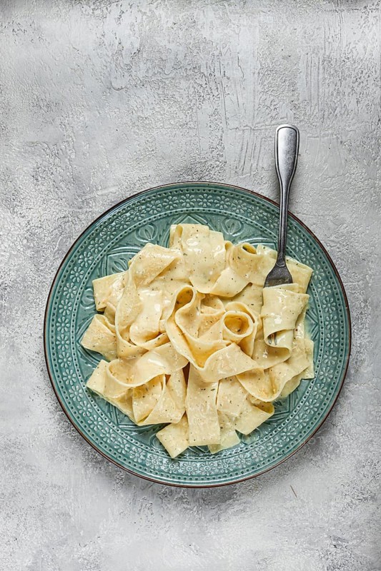 Pasta papardelle in creamy garlic sauce, traditional Italian cuisine, pasta carbonara, homemade, no people