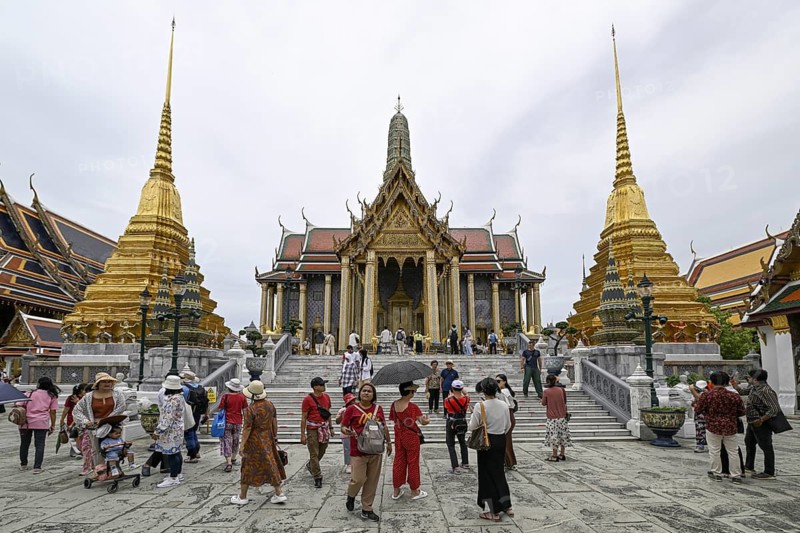 Tourists at Wat Phra Kaew, Temple of the Emerald Buddha, Bangkok, Thailand
