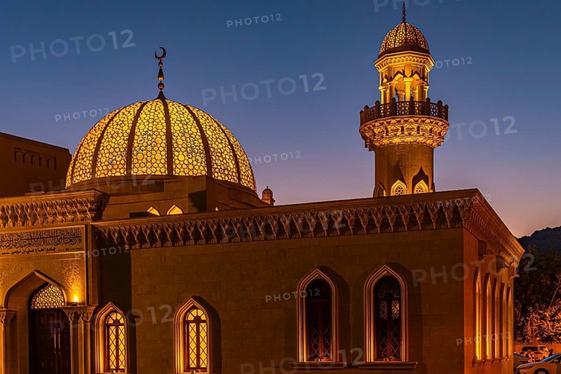 Illuminated mosque at the Sultan's Palace at dusk, Muscat, Arabian Peninsula, Sultanate of Oman