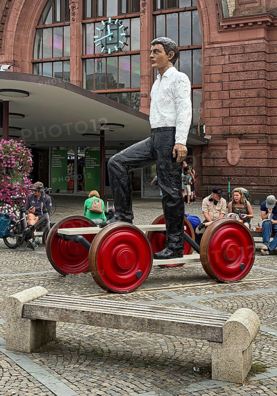 Artwork titled Homo Mobilis by Stephan Balkenhohl on Theodor-Heuss-Platz at the main train station, Osnabrück, Lower Saxony, Germany