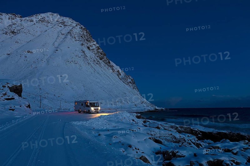 Motorhome in winter on pitch, Storsandnes Beach, Myrland, Lofoten, Norway