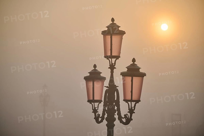 Lanterns at 'Alilaguna' at sunrise in Venice on a foggy morning in winter, Italy