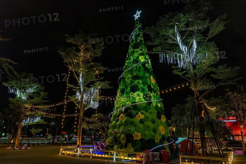 Illuminated Christmas tree made of green and yellow umbrellas, Chiang Mai, Thailand