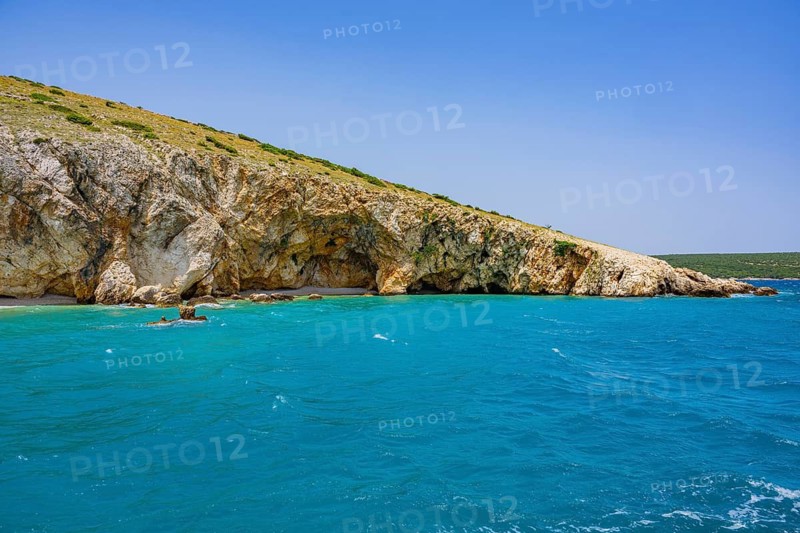 Romantic view over the sea in Koromacna Bay on a sunny day with rough seas on the island of Cres, long exposure, Croatia