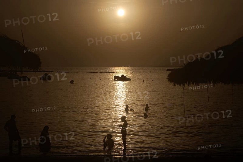 The sun sets on the horizon over the sea on the Spanish Balearic island of Majorca, Colonia de Sant Jordi, Majorca, Spain
