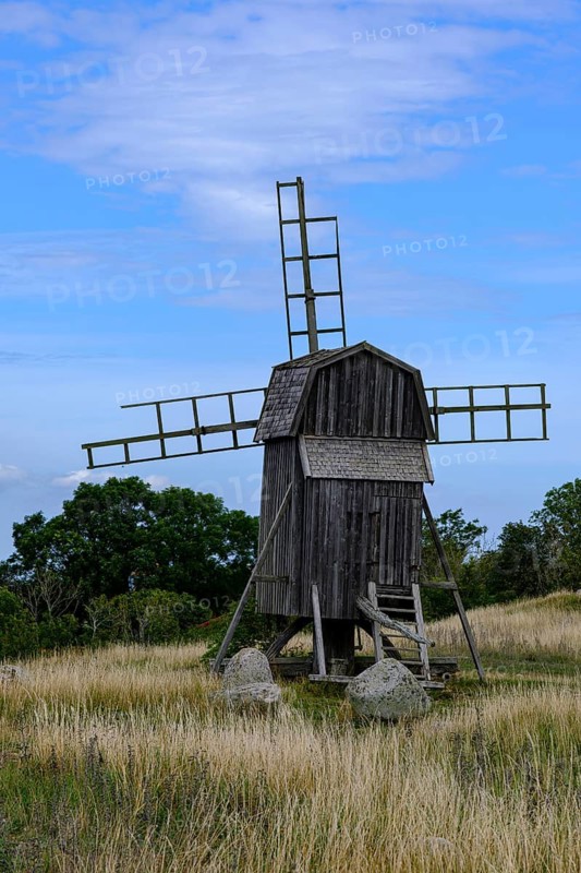 Traditional trestle windmill at the Gettlinge burial ground (Gettlinge gravfält), which was used from the Early Bronze Age to the Viking Age, in the south of the island of Öland, Kalmar län, Sweden