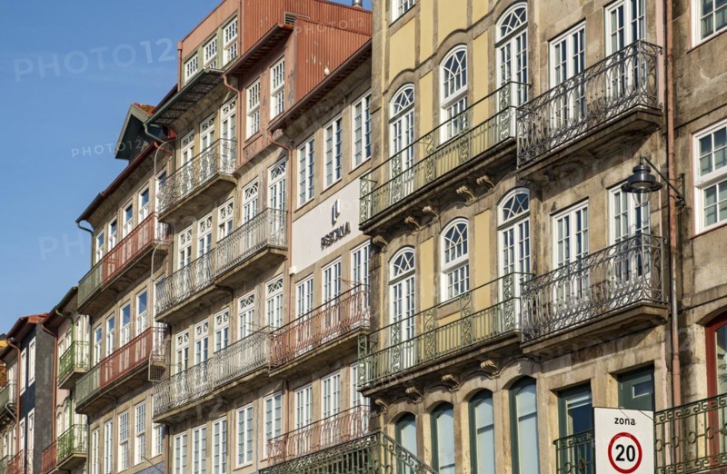 Colorful facades of houses along Cais da Estiva in the Ribeira district, Porto, Portugal