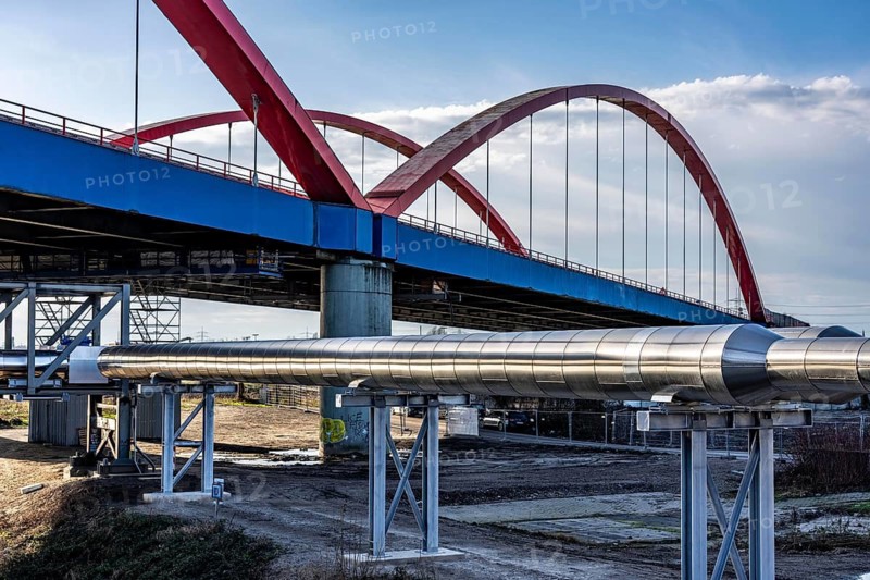 Iqony district heating pipes at the city port, crosses the Rhine-Herne Canal in Essen, A42 motorway bridge, North Rhine-Westphalia, Germany