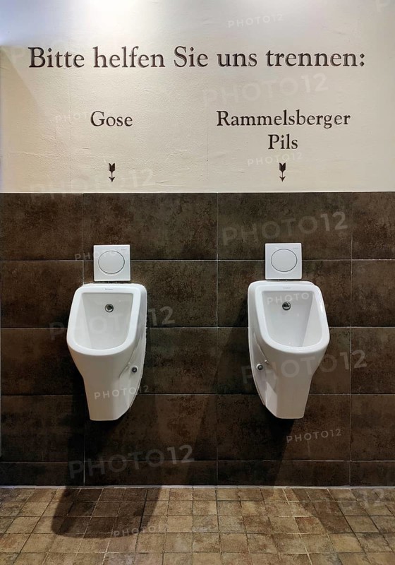 Two urinals with the witty request Please help us separate, Gose on the left, Rammelsberger Pils on the right, Goslar, Lower Saxony, Germany