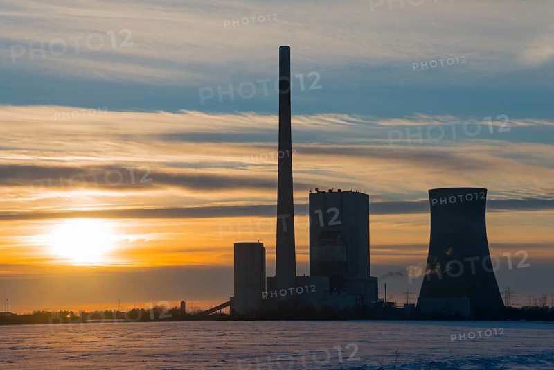 Industrial site at sunset, with chimney and cooling tower, surrounded by clouds, coal-fired power station, coal-fired power station, Mehrum, Peine district, Lower Saxony, Germany