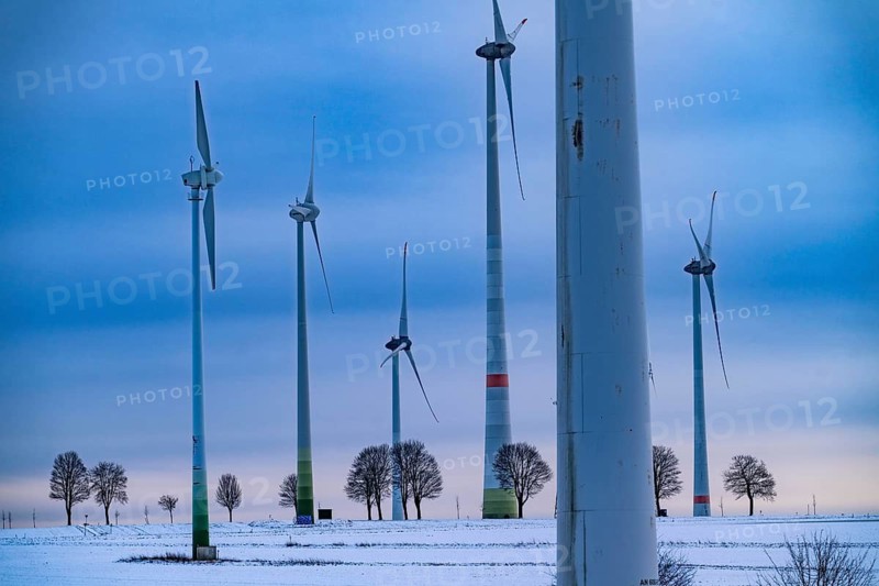 Wind farm, north of Lichtenau, self-proclaimed energy town, over 190 wind turbines and over 1200 solar panels generate 10 times as much electricity as the community of 11, 900 inhabitants consumes, largest onshore cluster of wind turbines in Germany, winter, slightly snow-covered landscape, North Rhine-Westphalia, Germany