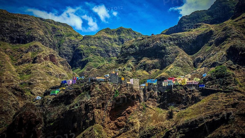 Panoramic view, small colorful settlement nestled in raw, dramatic mountains under blue skies, spectacular hiking, natural heritage, cultural heritage, terraces in Fontainhas, Santo Antao, Cabo Verde, Cape Verde, Cape Verde, Cape Verde