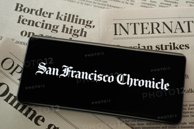 Dhaka, Bangladesh - 18 March 2025: The logo of the sun francisco chronicle is displayed on a smartphone screen