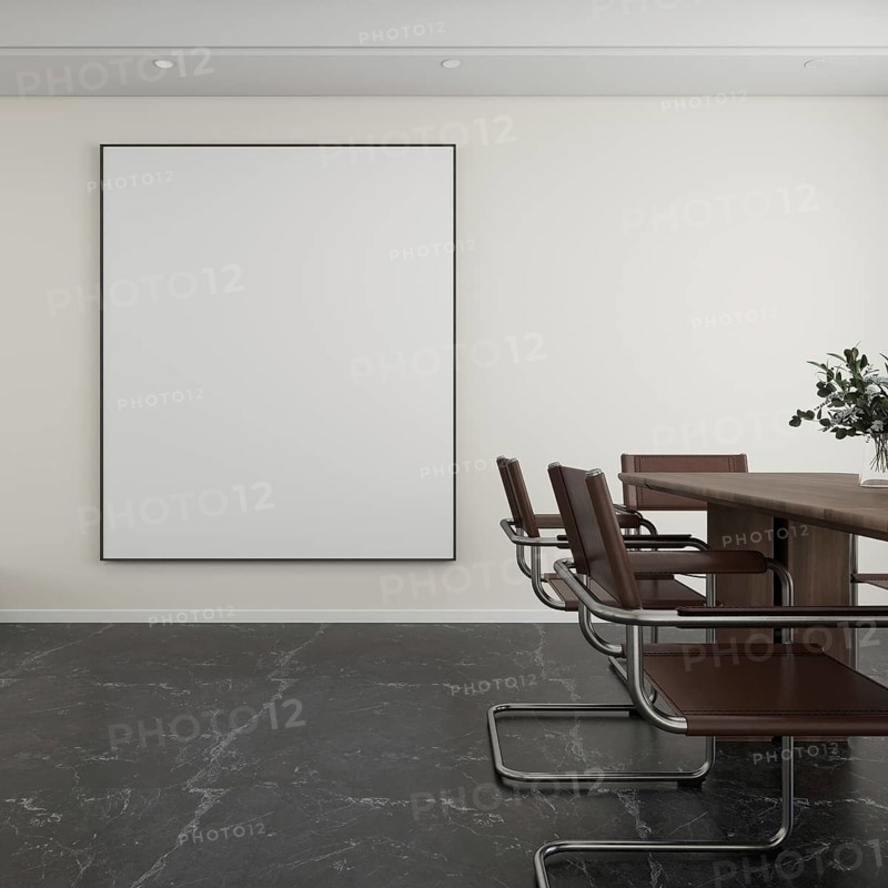 Elegant living room featuring a large blank canvas on the wall, sleek brown chairs, a wooden table, and subtle lighting. Perfect for meetings