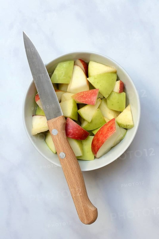 Apple pieces in peel with knife, apple, malus