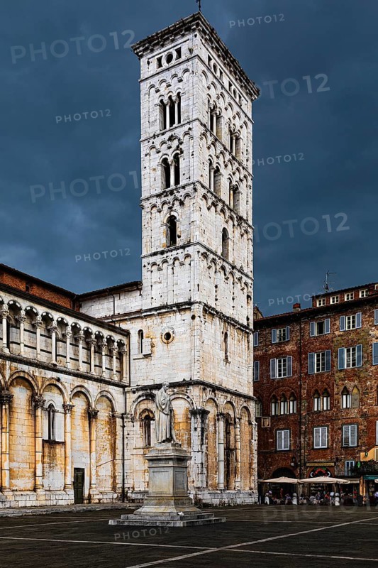 Dark rain clouds over the bell tower of the church of San Michele in Foro, historic city centre, Lucca, Tuscany, Italy