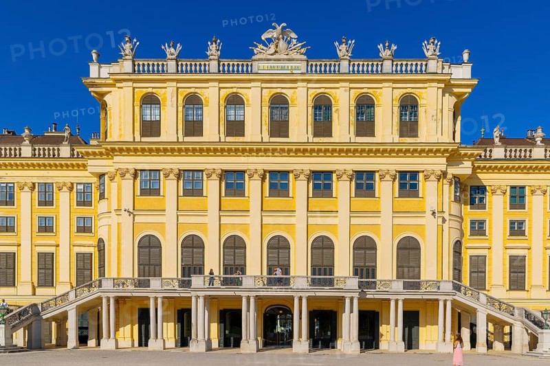 A majestic partial view of Schönbrunn Palace with its characteristic yellow façade, Vienna, Austria