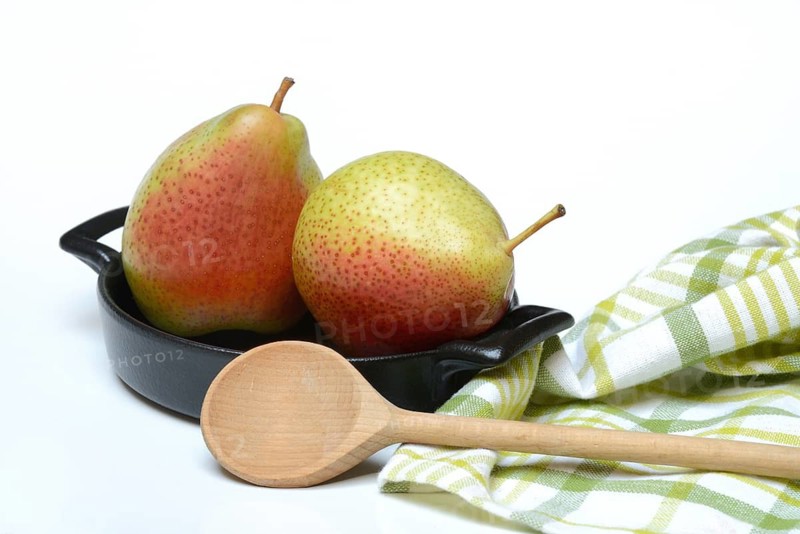 Pears in pot with cooking spoon, symbolic picture