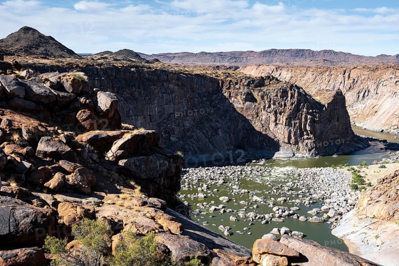 River bed and dump on the Orange River, Augrabies Falls National Park, Northern Cape, South Africa
