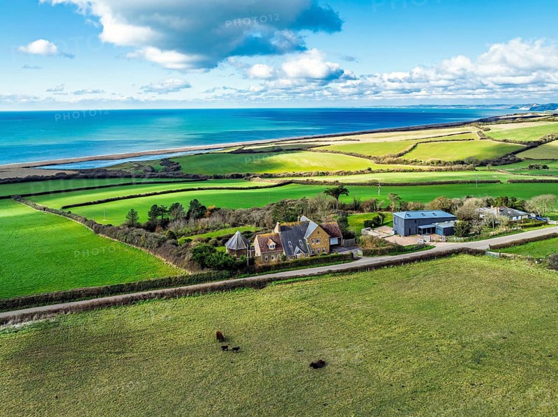 Farms over Swyre and West Bexington from a drone, West Bexington Nature Reserve, S W Coast Path, Dorchester, Dorset, England, United Kingdom
