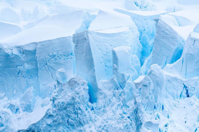 Glacier breakout with crevasses and shimmering blue ice formations, detailed view, Antarctic Peninsula, Antarctic
