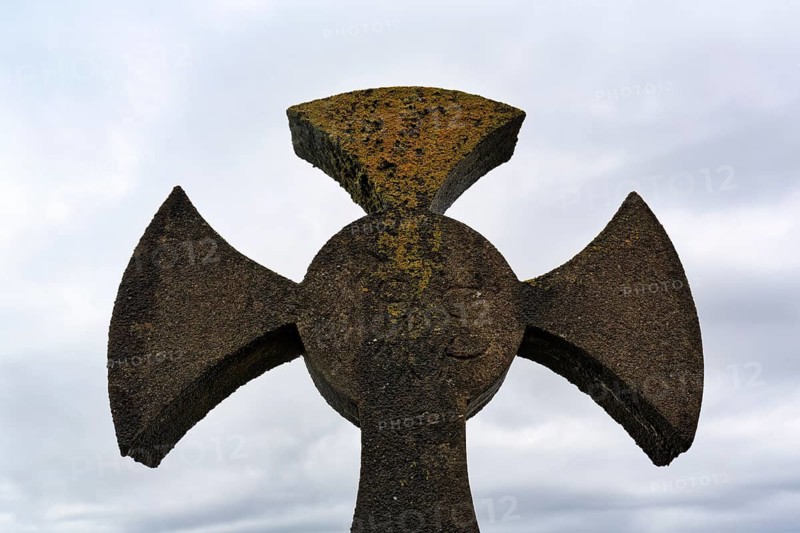 Celtic cross against grey background, sky, Kilcatherine Cemetery, Ring of Beara coastal road, Beara Peninsula, County Cork, Wild Atlantic Way, Ireland
