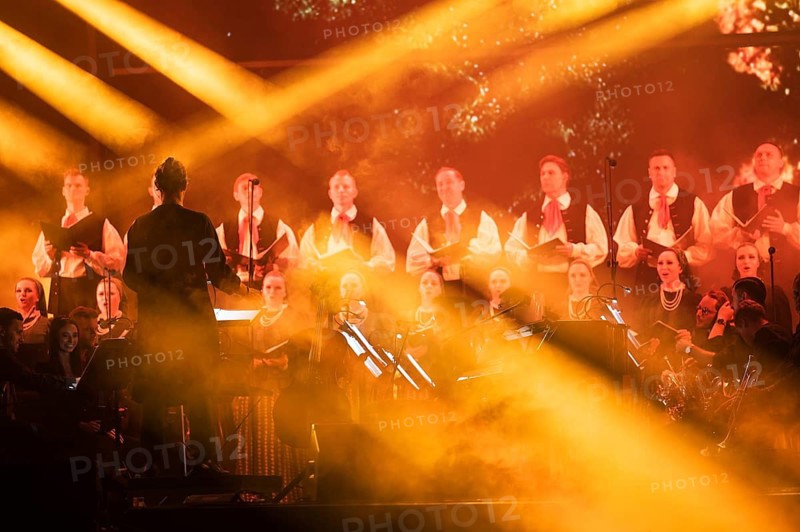 WROCLAW, POLAND - AUGUST 12, 2023: Festival Meskie Granie (Man's playing) concert Miuosh x Band Slask conductor Jan Stokolosa