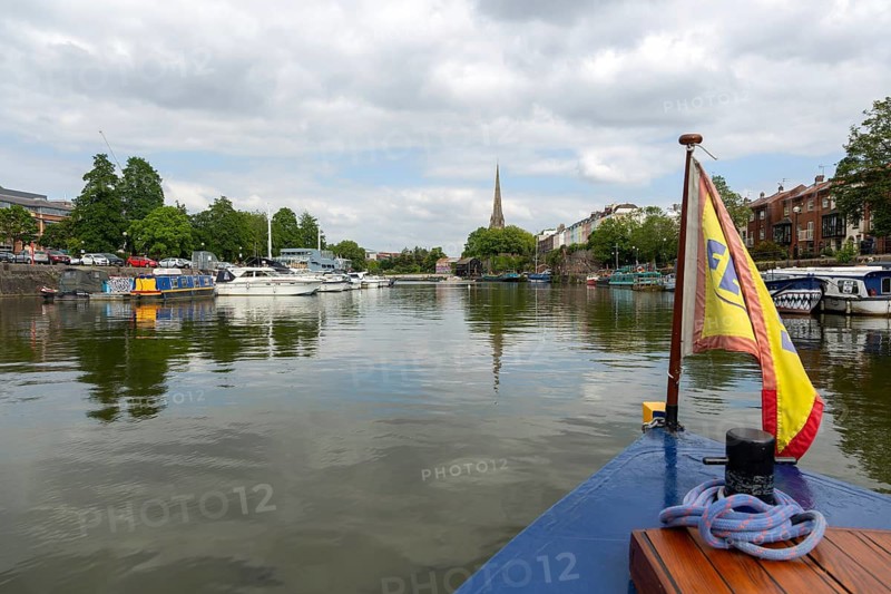 Spire of Saint Mary Redcliff church from Floating Harbour, Bristol, England, UK view from ferry boat