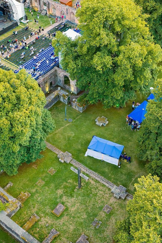 Bird's-eye view of ruins with crosses and tents surrounded by trees, Calwer Klostersommer Festival, Hirsau Abbey, Calw, Black Forest, Germany