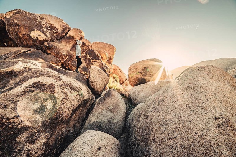 Woman hiking at sunrise in Joshua Tree National Park