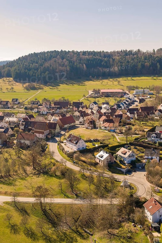 Hilly village with residential buildings and roads in a sunny, green landscape, Pfrondorf, Nagold, Calw district, Germany
