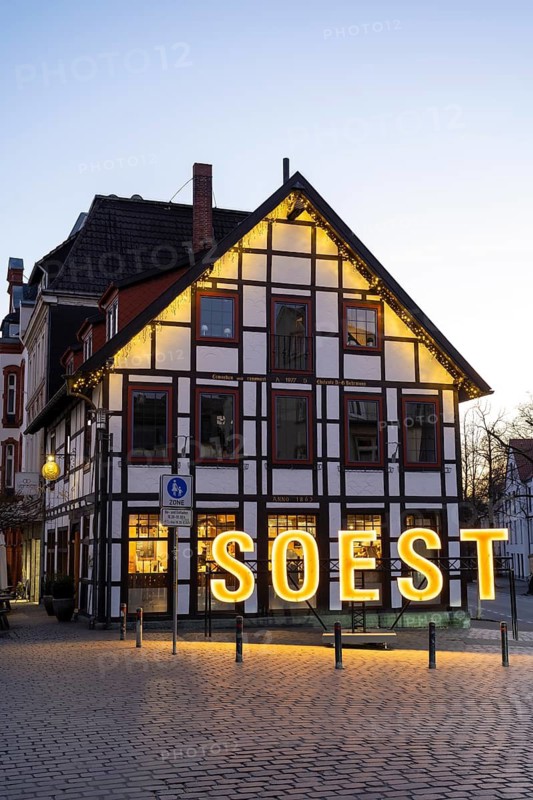 Letters form the word Soest in front of a half-timbered house, Blue Hour, Soest, North Rhine-Westphalia, Germany