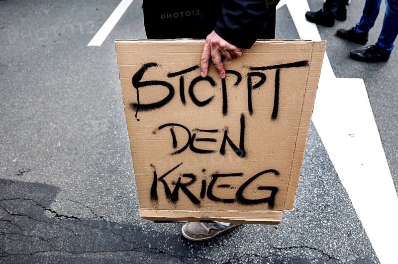 Stop the war poster at the demonstration of the alliance Never again war, Berlin, 03.10.2024. The participants are against the stationing of US missiles in Germany, against the war in Ukraine and against German arms deliveries to Ukraine and Israel, Berlin, Berlin, Germany