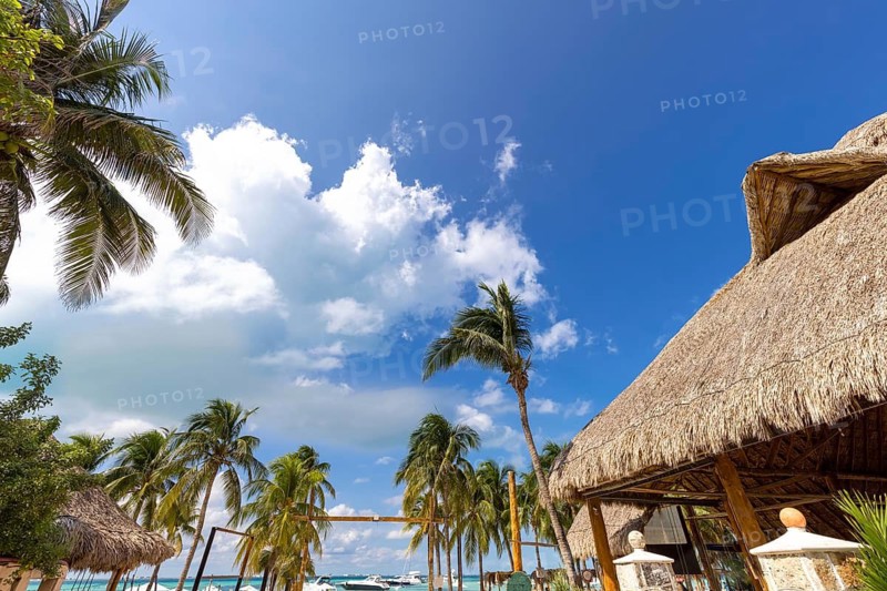 Serene turquoise Isla Mujeres beach Playa Norte famous for emerald waters, sandy sea shore and beach bars for fun and beach parties