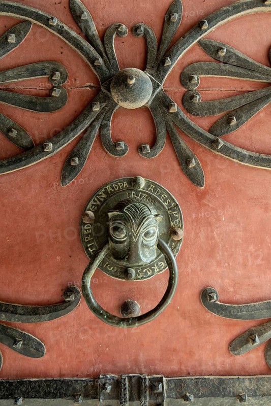 Ebreuil village, bronze door knocker of Saint-Leger benedictine abbey, Allier department, Auvergne-Rhone-Alpes, France
